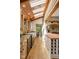 Sun-drenched kitchen featuring skylights, wood ceiling, and central island with wine rack at 9601 Irishmans Run Ln, Zionsville, IN 46077