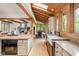 Spacious kitchen with wood floors, granite countertops, and views of the backyard at 9601 Irishmans Run Ln, Zionsville, IN 46077