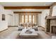 The living room boasts natural light, a stone fireplace, and neutral accents for a cozy, sophisticated atmosphere at 9601 Irishmans Run Ln, Zionsville, IN 46077