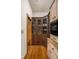 Pantry features dark wood cabinets with glass doors and granite countertops adding character to this space at 9601 Irishmans Run Ln, Zionsville, IN 46077