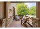 Relax on the front porch with stone accents and peaceful views at 9601 Irishmans Run Ln, Zionsville, IN 46077
