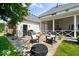 Backyard featuring a stone patio, firepit, and outdoor grill at 9973 Woods Edge Dr, Fishers, IN 46037
