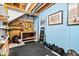 Unfinished basement with workbench, tool rack, and weights at 9973 Woods Edge Dr, Fishers, IN 46037