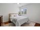 Comfortable bedroom with a queen bed, neutral decor, and a sunlit window at 9973 Woods Edge Dr, Fishers, IN 46037