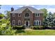 Beautiful brick two-story home with manicured lawn and mature landscaping at 9973 Woods Edge Dr, Fishers, IN 46037