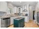 Modern kitchen featuring white cabinetry, stainless steel appliances, and desk at 9973 Woods Edge Dr, Fishers, IN 46037