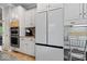 Kitchen showcasing white cabinets and stainless steel appliances at 9973 Woods Edge Dr, Fishers, IN 46037