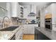 Stylish kitchen with stainless steel appliances, island, and tile backsplash at 9973 Woods Edge Dr, Fishers, IN 46037