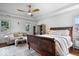 Bright main bedroom boasts tray ceiling, sitting area, and large windows at 9973 Woods Edge Dr, Fishers, IN 46037