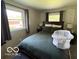 Cozy bedroom with a comfortable bed, soft lighting, and coordinated decor for relaxation at 101 E Hill Valley E Dr, Indianapolis, IN 46227