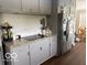 Kitchen featuring stainless steel refrigerator, granite countertop, and hardwood floor, plus adjacent eating area at 101 E Hill Valley E Dr, Indianapolis, IN 46227