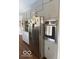 Bright kitchen featuring stainless steel appliances, including a refrigerator and built-in oven, plus ample storage at 101 E Hill Valley E Dr, Indianapolis, IN 46227