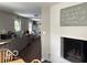 Open kitchen view with grey cabinets, granite counters, stainless appliances, and adjacent dining area at 101 E Hill Valley E Dr, Indianapolis, IN 46227