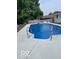 Backyard in-ground pool offers a refreshing escape on a sunny day at 101 E Hill Valley E Dr, Indianapolis, IN 46227