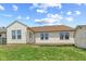 Backyard featuring a shed, wooden deck, and grassy area at 10693 Newgate Ln, Indianapolis, IN 46231