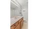 Bathroom features a single sink vanity with wooden drawers and updated fixtures at 10693 Newgate Ln, Indianapolis, IN 46231