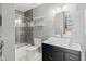 Modern bathroom featuring stylish vanity with vessel sink, tiled shower, and decorative mirror at 10693 Newgate Ln, Indianapolis, IN 46231