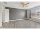 Spacious bedroom featuring wood-look flooring, a ceiling fan, and a neutral paint at 10693 Newgate Ln, Indianapolis, IN 46231