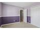 Cozy bedroom featuring neutral carpet, baseboard trim, and a closet at 10693 Newgate Ln, Indianapolis, IN 46231