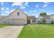 Charming home featuring a two-car garage, neat lawn and lovely curb appeal at 10693 Newgate Ln, Indianapolis, IN 46231