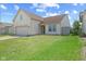 Charming home featuring a two-car garage, neat lawn and lovely curb appeal at 10693 Newgate Ln, Indianapolis, IN 46231
