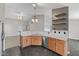 A view into the kitchen with stainless steel appliances and light wood cabinets at 10693 Newgate Ln, Indianapolis, IN 46231