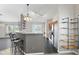 Open kitchen featuring stainless steel appliances, breakfast bar, and sleek countertops at 10693 Newgate Ln, Indianapolis, IN 46231