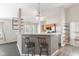 Open kitchen featuring stainless steel appliances, breakfast bar, and sleek countertops at 10693 Newgate Ln, Indianapolis, IN 46231
