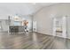 Open concept living room featuring hardwood floors, vaulted ceiling, and natural light at 10693 Newgate Ln, Indianapolis, IN 46231