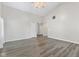 Bright living room featuring hard wood floors and a vaulted ceiling at 10693 Newgate Ln, Indianapolis, IN 46231
