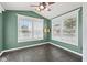 Bright sun room with large windows, offering plenty of natural light and neutral paint at 10693 Newgate Ln, Indianapolis, IN 46231