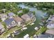 An elevated aerial shot showcasing the picturesque lake community with waterfront homes and boat docks at 11244 Blackwalnut Pt, Indianapolis, IN 46236