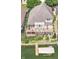 Stunning aerial view of waterfront home featuring multiple decks, boat dock and lush landscaping at 11244 Blackwalnut Pt, Indianapolis, IN 46236