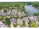 Expansive aerial view captures a tranquil neighborhood on the lake with private boat docks for each house at 11244 Blackwalnut Pt, Indianapolis, IN 46236