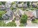 Neighborhood aerial view of lakeside homes boasting lush greenery, docks, and waterfront access at 11244 Blackwalnut Pt, Indianapolis, IN 46236