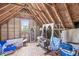 Attic featuring a window with exposed beams and stored items at 11244 Blackwalnut Pt, Indianapolis, IN 46236