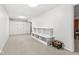 Basement with neutral colored walls and carpet, with built-in storage at 11244 Blackwalnut Pt, Indianapolis, IN 46236