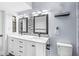 Modern bathroom with double vanity, marble countertops, and stylish mirrors and lighting fixtures at 11244 Blackwalnut Pt, Indianapolis, IN 46236