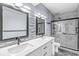 Contemporary bathroom features a double vanity, glass enclosed shower, and sleek design elements at 11244 Blackwalnut Pt, Indianapolis, IN 46236