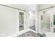 Well-appointed bathroom featuring a walk-in shower and an adjacent toilet room at 11244 Blackwalnut Pt, Indianapolis, IN 46236