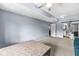 Bright and airy bedroom offering ample space, neutral walls, and a glimpse into the attached bathroom at 11244 Blackwalnut Pt, Indianapolis, IN 46236