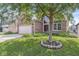 Beautiful brick home with well-kept lawn and mature trees, showcasing curb appeal at 11244 Blackwalnut Pt, Indianapolis, IN 46236