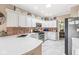 Spacious kitchen featuring white countertops, stainless steel appliances and ample storage space at 11244 Blackwalnut Pt, Indianapolis, IN 46236