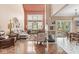 Bright living room with fireplace, hardwood floors, vaulted ceiling, and stained glass window at 11244 Blackwalnut Pt, Indianapolis, IN 46236