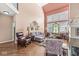 Large living room features vaulted ceilings, hardwood floors, and stained glass window at 11244 Blackwalnut Pt, Indianapolis, IN 46236