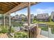 Scenic waterfront view from covered patio, perfect for relaxing and entertaining guests at 11244 Blackwalnut Pt, Indianapolis, IN 46236
