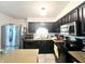 Functional kitchen featuring dark cabinetry and stainless steel appliances at 1129 Nantucket Dr, Cicero, IN 46034