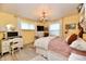 Bedroom with yellow walls, white accents, and a chandelier, offering a bright and cozy space at 121 Mulberry Dr, Chesterfield, IN 46017