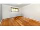 An empty bedroom with hardwood floors and a window at 121 Mulberry Dr, Chesterfield, IN 46017