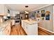 Bright kitchen featuring stainless steel appliances, a large island, and wood-look flooring at 121 Mulberry Dr, Chesterfield, IN 46017